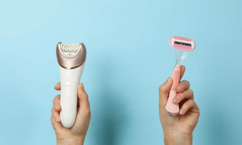 A person holding razor in his left hand and hair clipper in his right hand