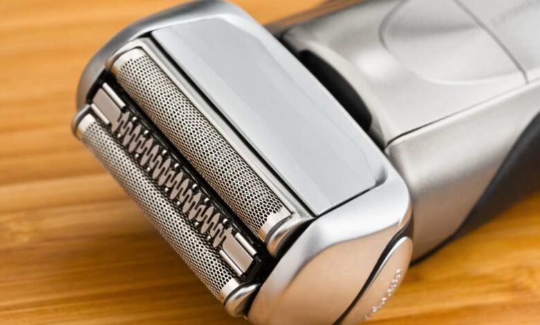a electric razor for men on wooden table