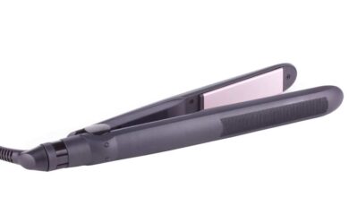A light black color cheap hair straightener with pink plate