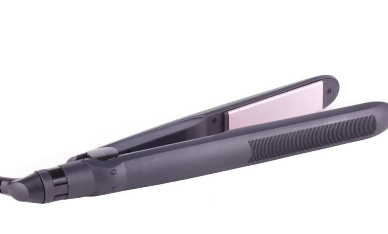 A light black color cheap hair straightener with pink plate