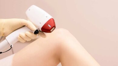 a girl using IPL hair removal on her leg | IPL vs Laser Hair Removal
