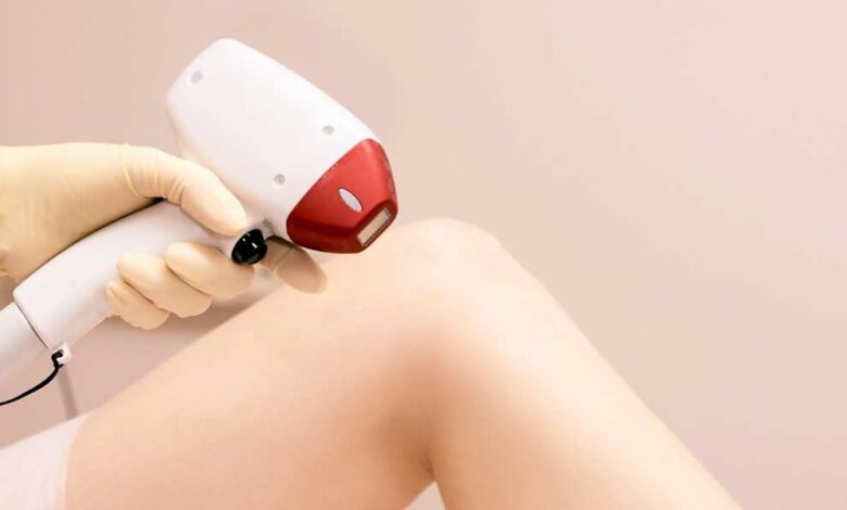 a girl using IPL hair removal on her leg | IPL vs Laser Hair Removal