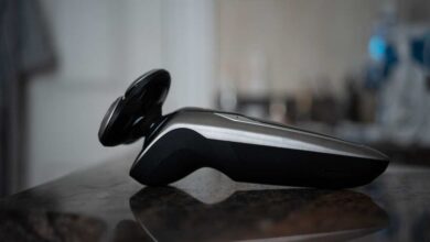 a Black Philips shaver on wooden table