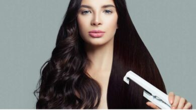 A girl using Straightener in her curly hiar, looking at camera | best hair straightener for curly hair