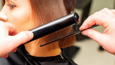a person straightening girl short hair with hair straightener | best hair straightener for short hair