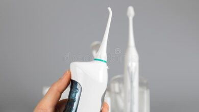 a white color water flosser portable model